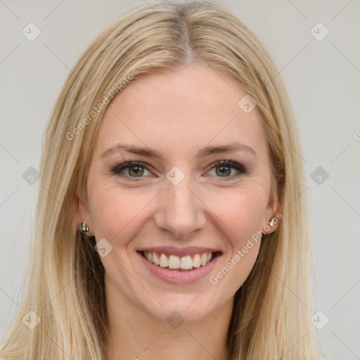 Joyful white young-adult female with long  brown hair and green eyes