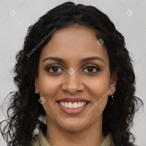 Joyful black young-adult female with long  brown hair and brown eyes