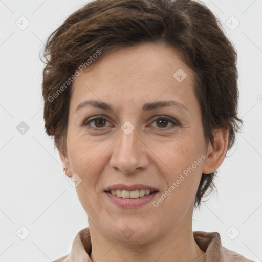 Joyful white adult female with short  brown hair and brown eyes