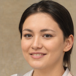 Joyful white young-adult female with medium  brown hair and brown eyes