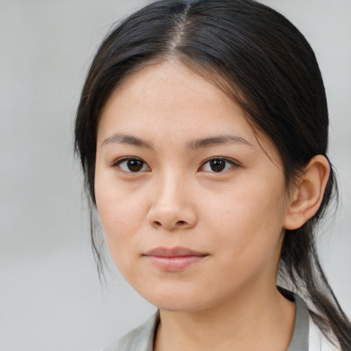 Neutral asian young-adult female with medium  brown hair and brown eyes