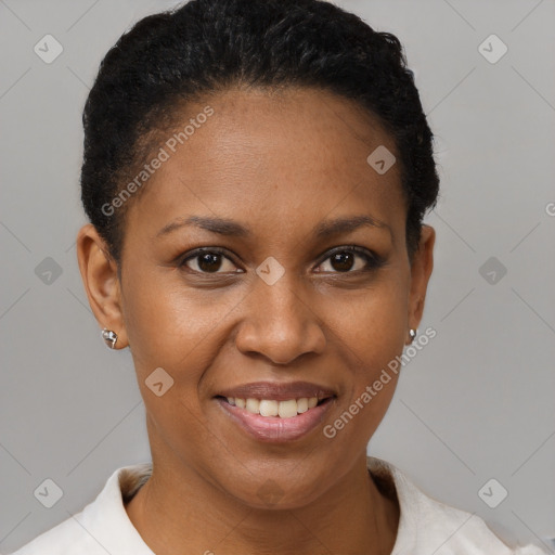 Joyful black young-adult female with short  brown hair and brown eyes