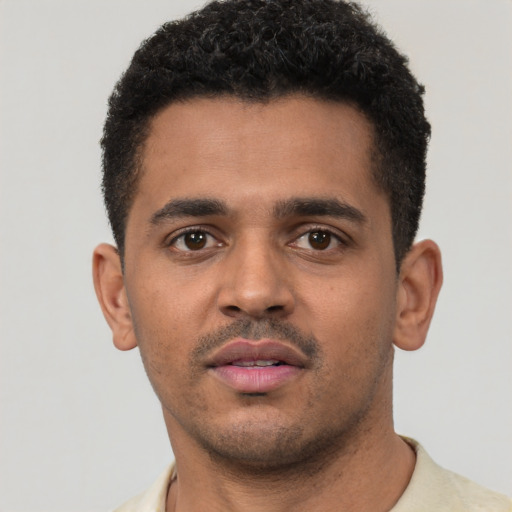 Neutral black young-adult male with short  black hair and brown eyes