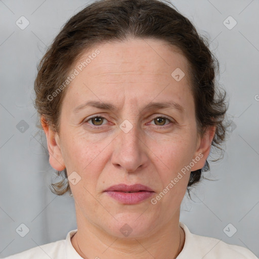 Joyful white adult female with short  brown hair and grey eyes