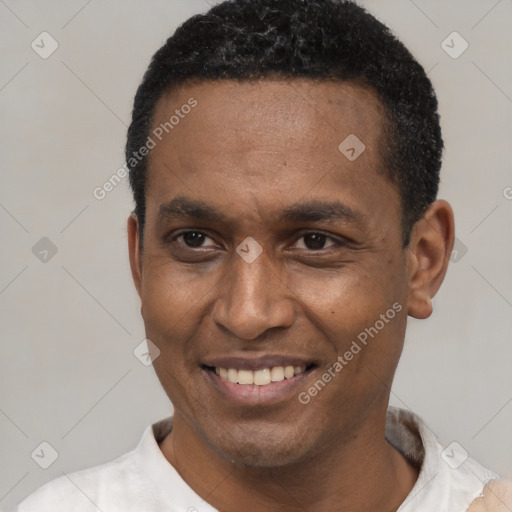 Joyful latino adult male with short  black hair and brown eyes