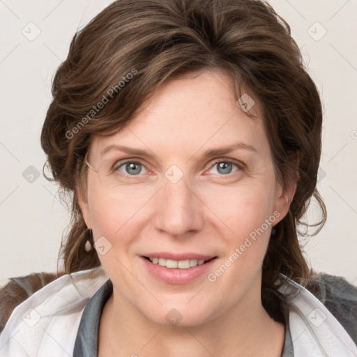 Joyful white young-adult female with medium  brown hair and blue eyes