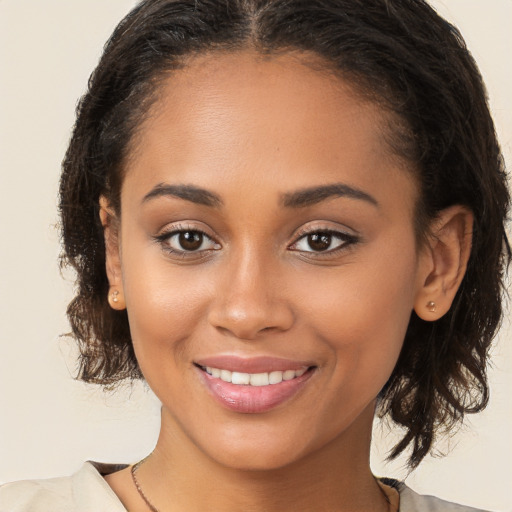 Joyful white young-adult female with long  brown hair and brown eyes