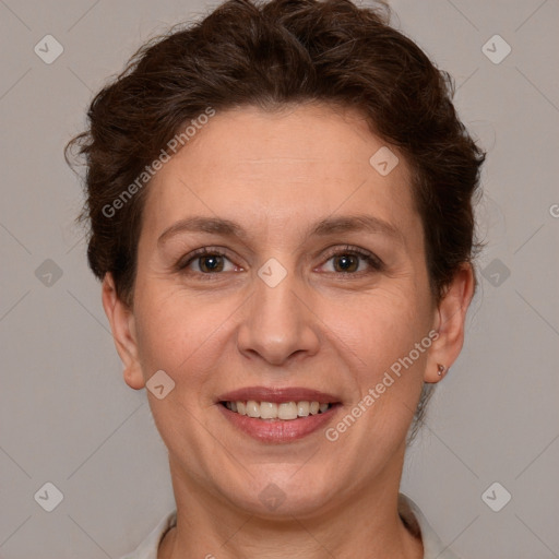 Joyful white adult female with short  brown hair and brown eyes