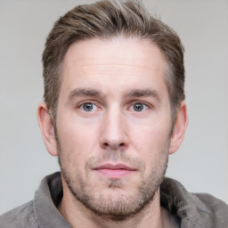 Neutral white young-adult male with short  brown hair and grey eyes
