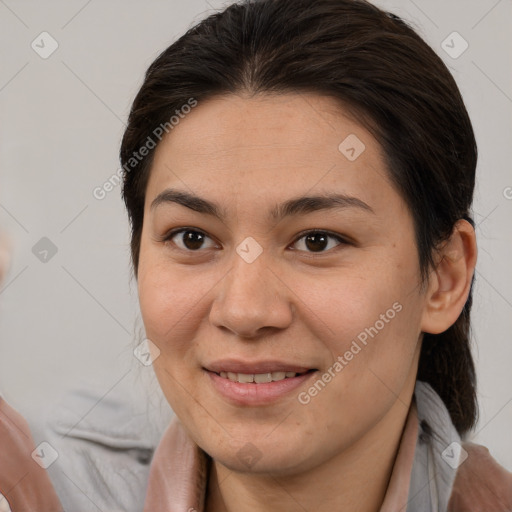 Joyful white adult female with medium  brown hair and brown eyes