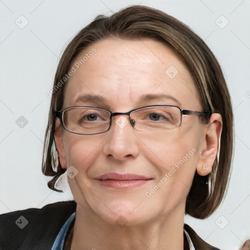 Joyful white adult female with medium  brown hair and blue eyes