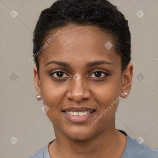 Joyful black young-adult female with short  brown hair and brown eyes