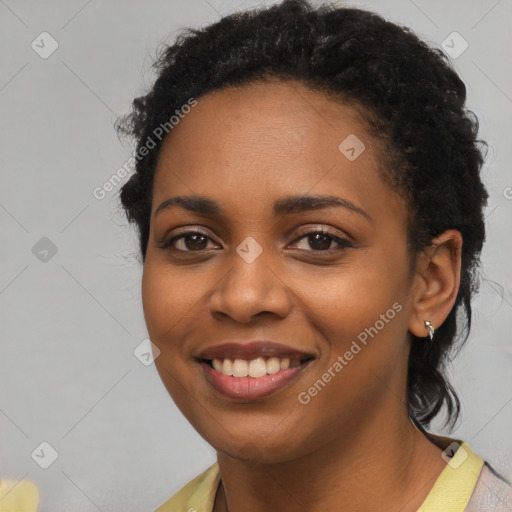 Joyful black young-adult female with medium  black hair and brown eyes