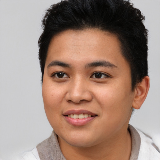 Joyful asian young-adult female with short  brown hair and brown eyes