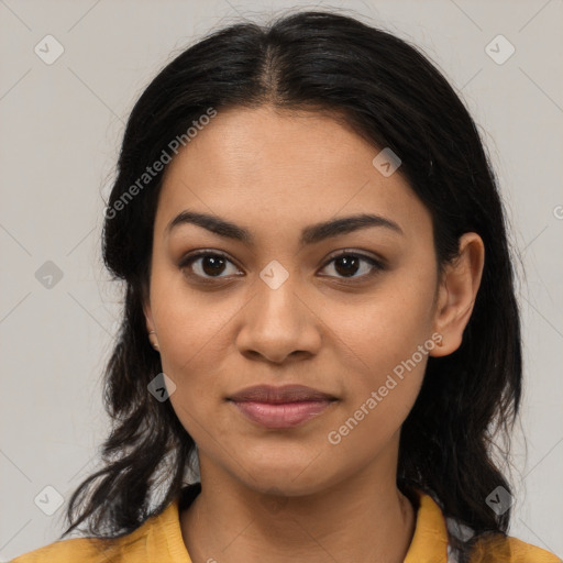 Joyful latino young-adult female with long  brown hair and brown eyes
