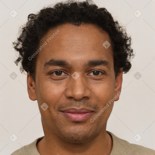 Joyful latino young-adult male with short  brown hair and brown eyes