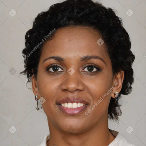 Joyful black young-adult female with short  black hair and brown eyes