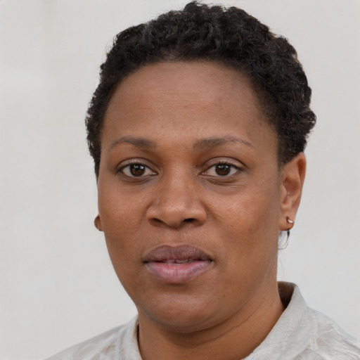 Neutral black young-adult female with short  black hair and brown eyes