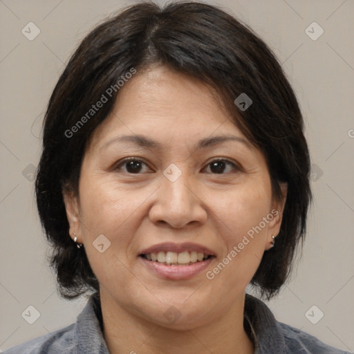 Joyful white adult female with medium  brown hair and brown eyes