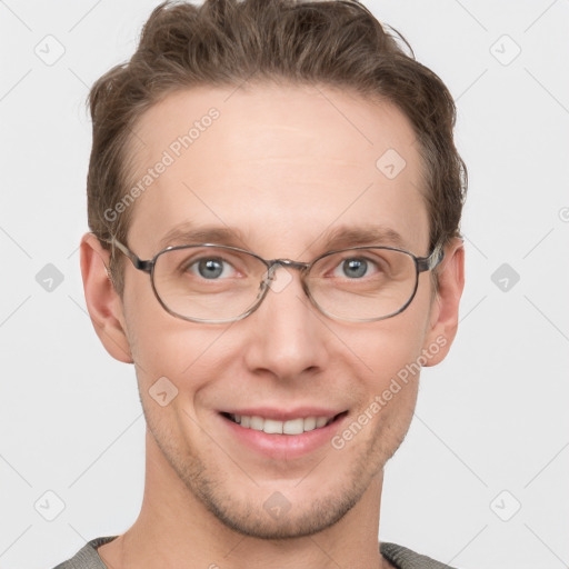 Joyful white adult male with short  brown hair and grey eyes