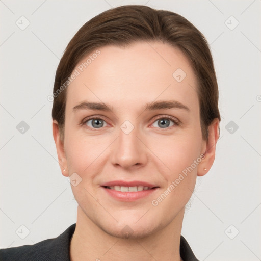 Joyful white young-adult female with short  brown hair and grey eyes