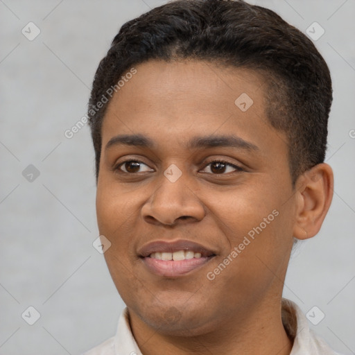 Joyful latino young-adult male with short  brown hair and brown eyes