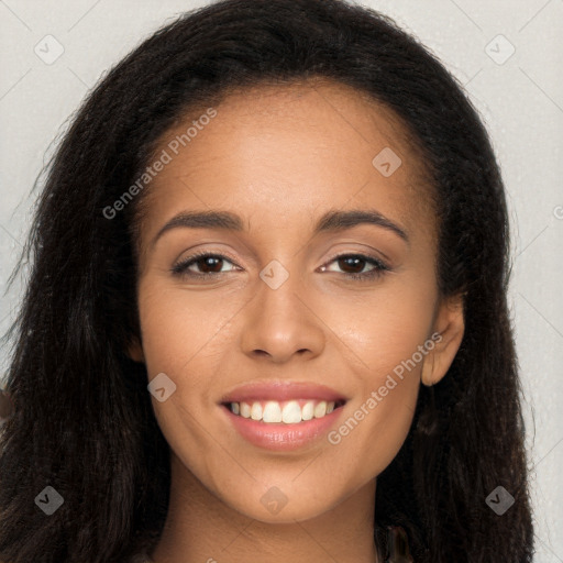 Joyful latino young-adult female with long  brown hair and brown eyes