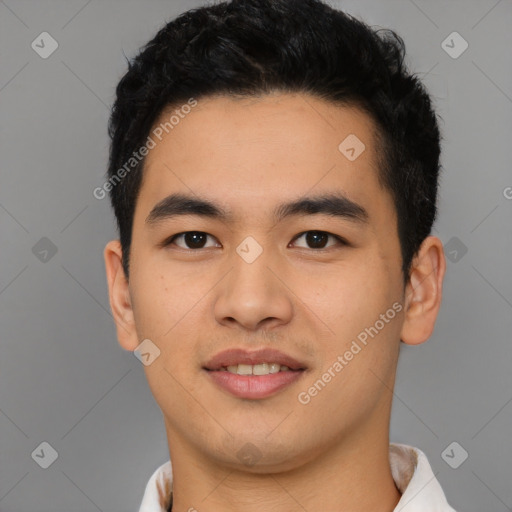 Joyful latino young-adult male with short  black hair and brown eyes