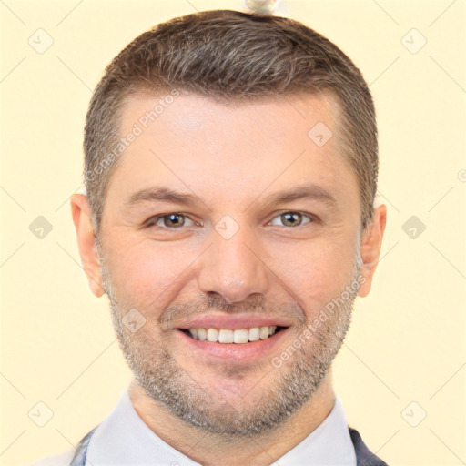 Joyful white adult male with short  brown hair and brown eyes