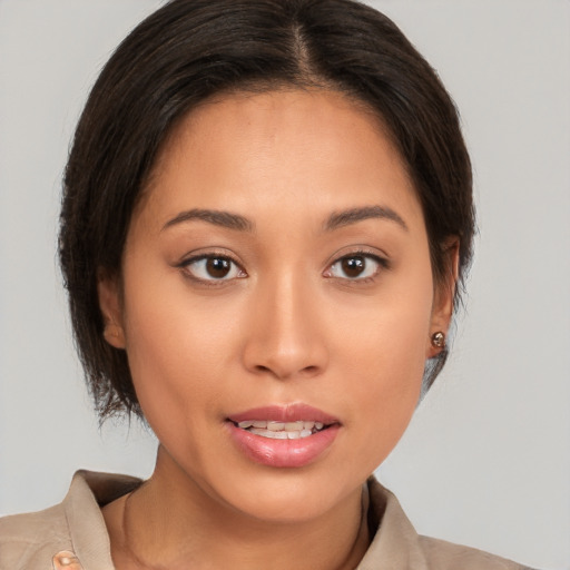 Joyful white young-adult female with medium  brown hair and brown eyes