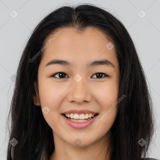 Joyful asian young-adult female with long  brown hair and brown eyes