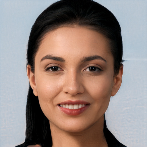 Joyful white young-adult female with long  black hair and brown eyes