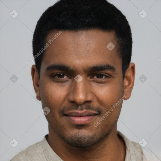 Joyful black young-adult male with short  black hair and brown eyes