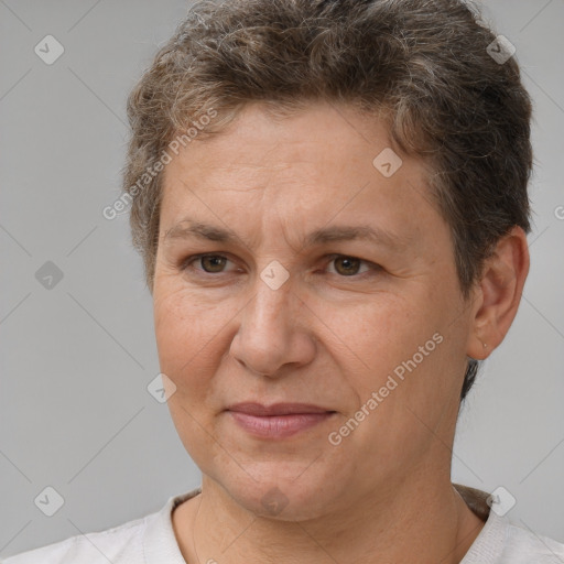 Joyful white adult female with short  brown hair and brown eyes