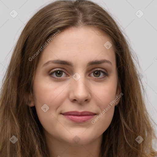 Joyful white young-adult female with long  brown hair and green eyes