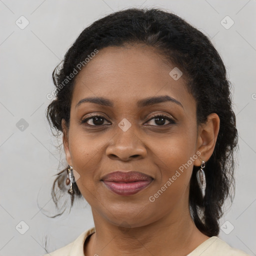 Joyful black young-adult female with medium  brown hair and brown eyes