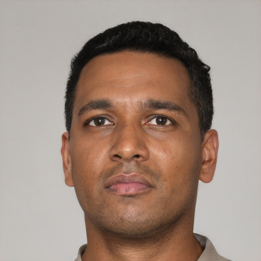Neutral black young-adult male with short  black hair and brown eyes