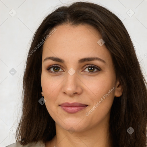 Joyful white young-adult female with long  brown hair and brown eyes