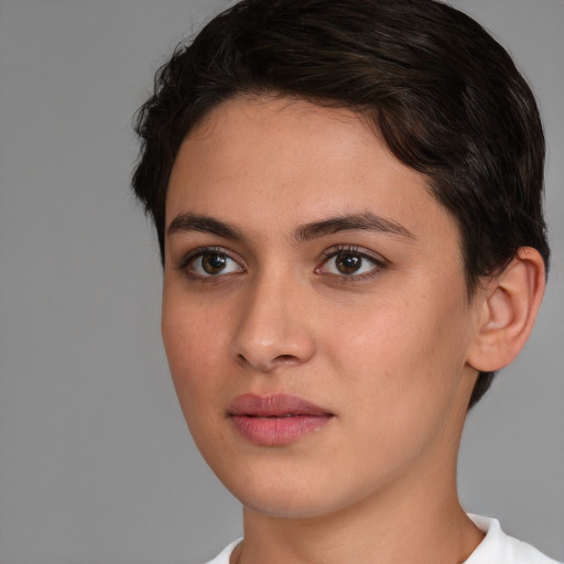 Joyful white young-adult female with short  brown hair and brown eyes