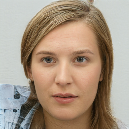 Neutral white young-adult female with long  brown hair and blue eyes