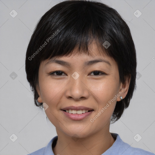 Joyful asian young-adult female with medium  black hair and brown eyes