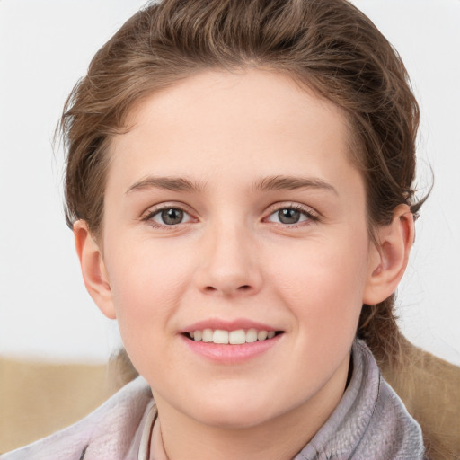 Joyful white young-adult female with short  brown hair and blue eyes