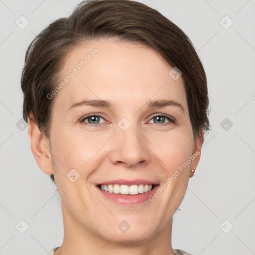 Joyful white young-adult female with short  brown hair and grey eyes