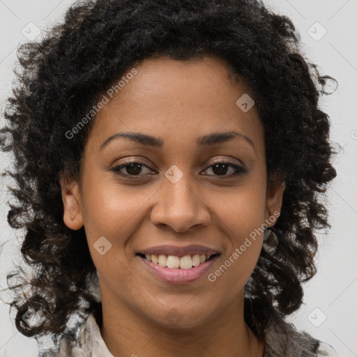 Joyful black young-adult female with long  brown hair and brown eyes