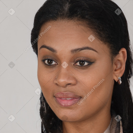 Joyful black young-adult female with long  brown hair and brown eyes