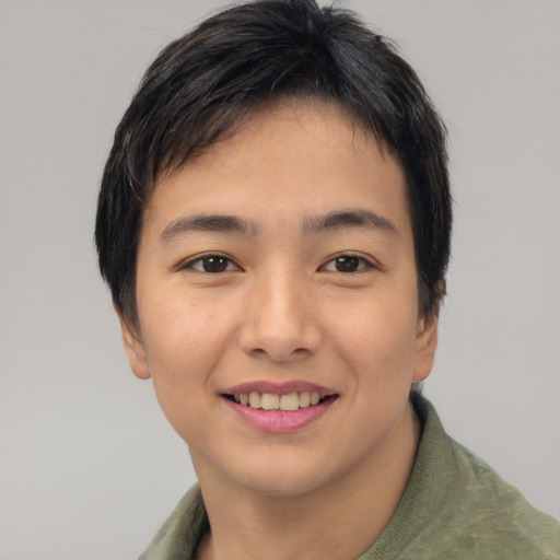 Joyful asian young-adult female with short  brown hair and brown eyes