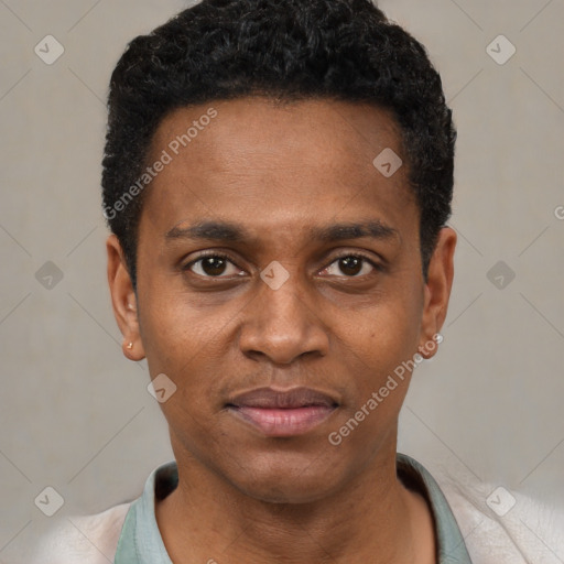 Joyful black young-adult male with short  black hair and brown eyes