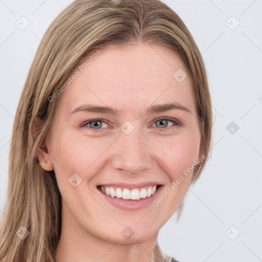 Joyful white young-adult female with long  brown hair and blue eyes