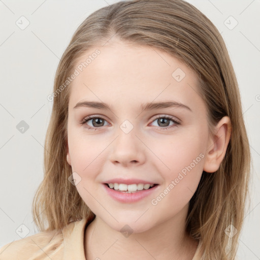 Joyful white child female with medium  brown hair and brown eyes