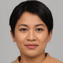 Joyful asian young-adult female with short  black hair and brown eyes